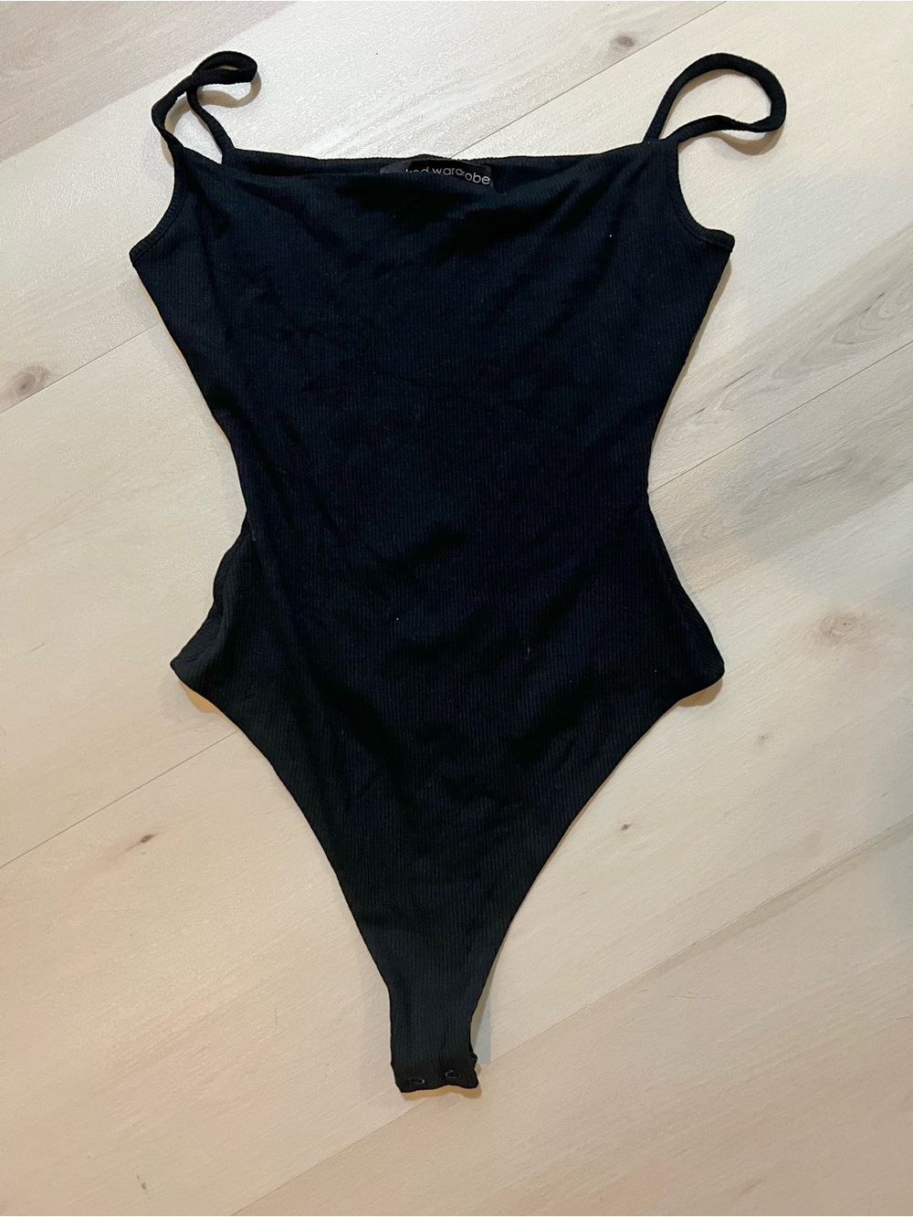 Naked Wardrobe Black Spaghetti Strap Ribbed Knit Bodysuit